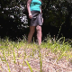 This crystal-clear, high-quality video features a woman taking a piss and a shit on the ground in grassy meadow outdoors. Presented in 720P HD. Over 3.5 minutes.